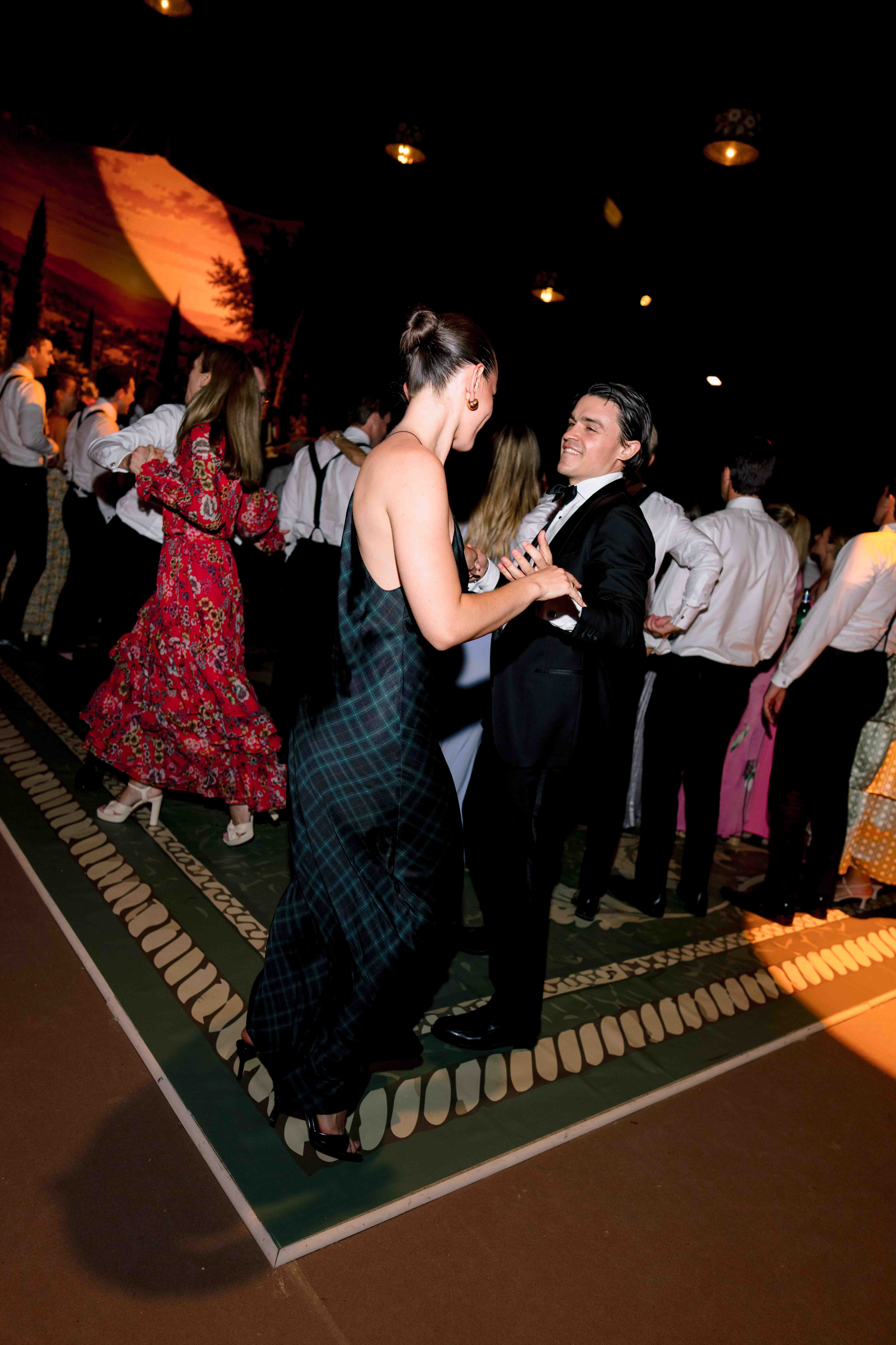 Candid wedding party photographed with direct flash in France